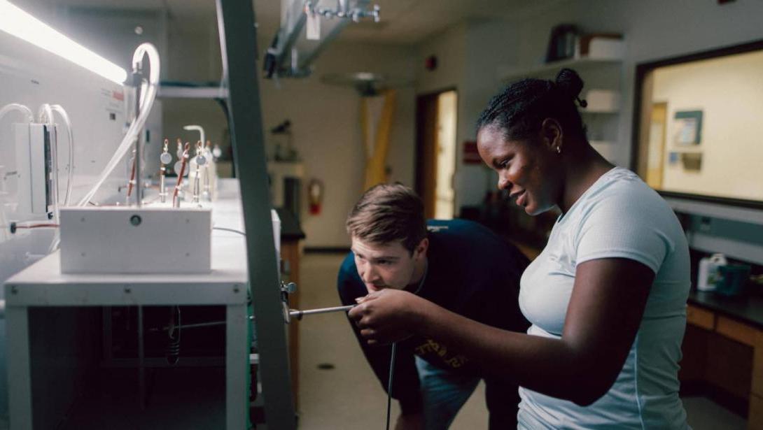 Two students working together in lab